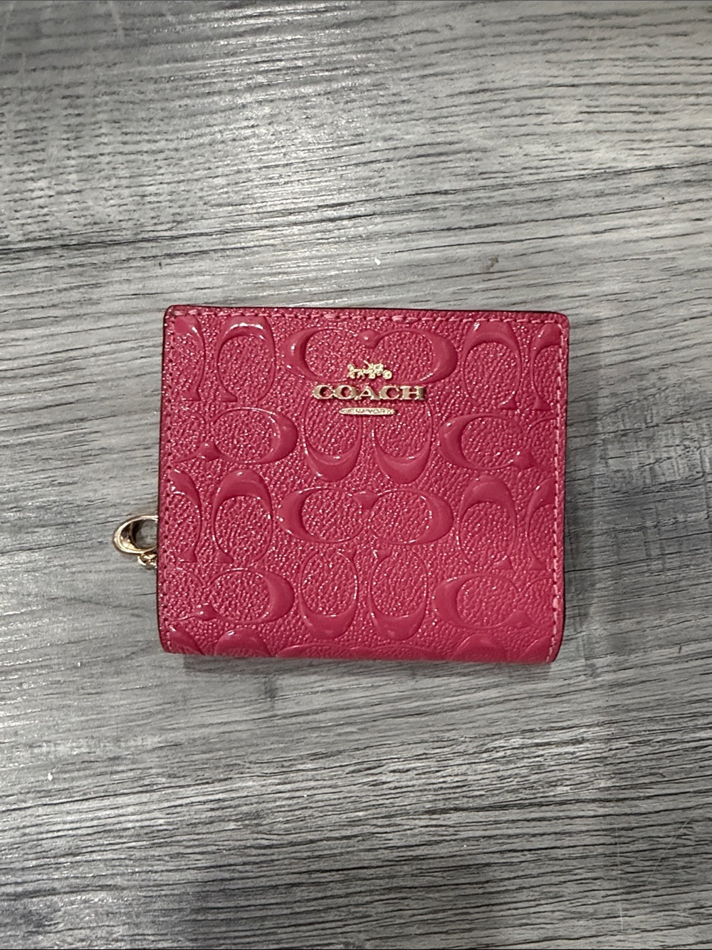 Coach Pink Signature Embossed Compact Wallet